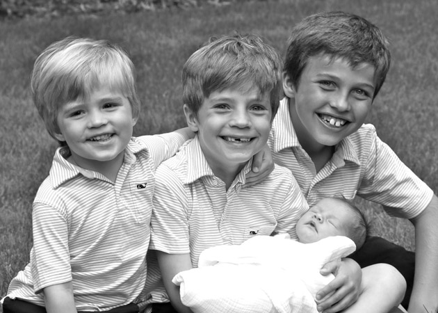 Capturing the closeness when three brothers welcome their new sibling into the family in Wellesley MA by Echo Cove Photography