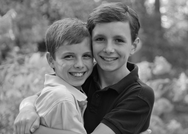 Capturing the closeness of two brothers during a Christmas card photo shoot in Wellesley MA by Echo Cove Photography