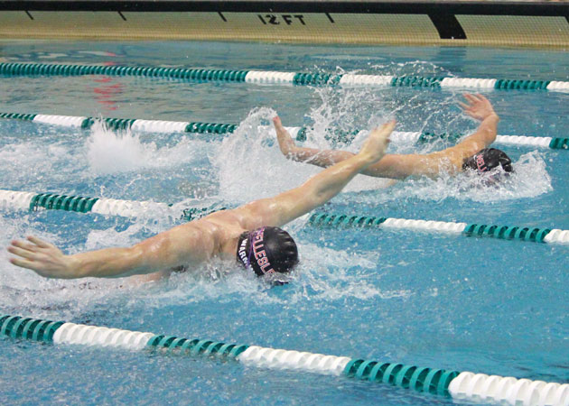 Capturing the fun of a close butterfly heat during a Wellesley swim meet by Echo Cove Photography