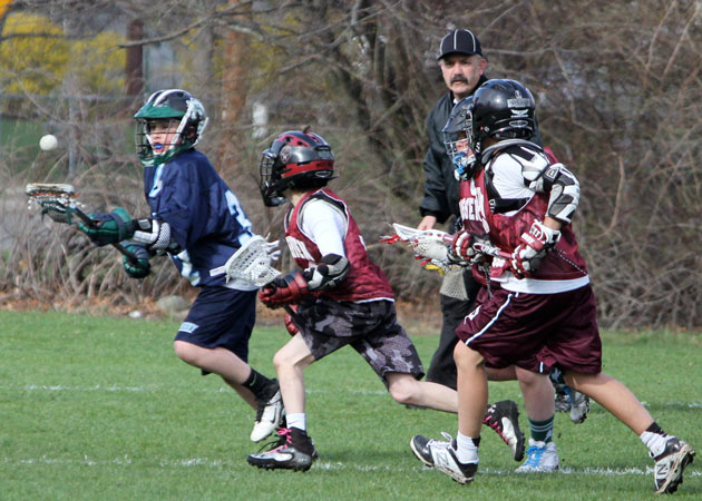 Capturing the fun and competition of U-12 town lacrosse game in Wellesley MA by Echo Cove Photography